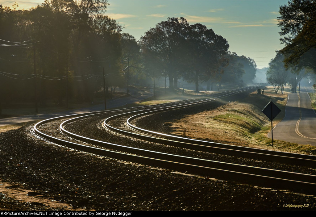 Early morning at the track, waiting for a train